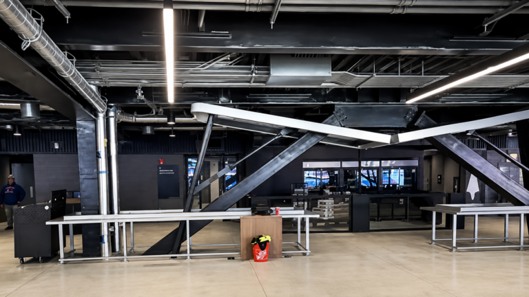 Broken folding table sculpture built into the concourse ceiling at Buffalo Bills' new Highmark Stadium