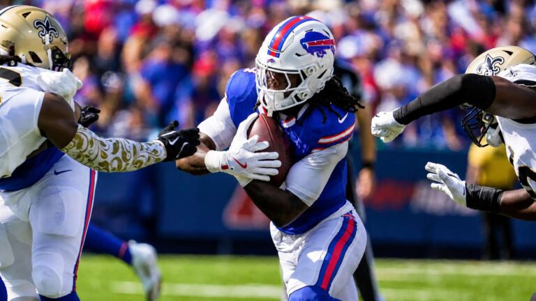 Buffalo Bills running back James Cook carries the ball during a 2025 game