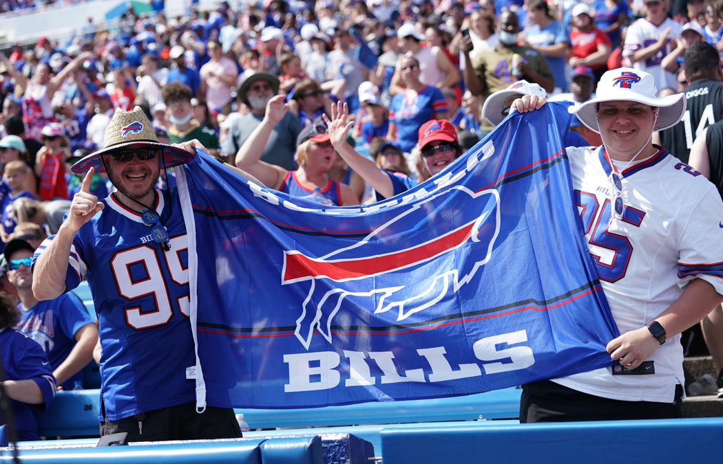 Buffalo Bills Community volunteers packing food donation boxes together