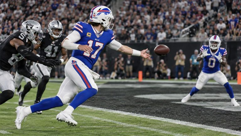 Josh Allen of the Buffalo Bills makes an off-balance flip pass to Keon Coleman for a touchdown against the Las Vegas Raiders on October 18, 2026.